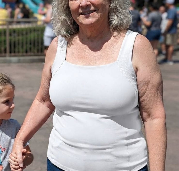 A woman wearing PamTanks in White, on a day out